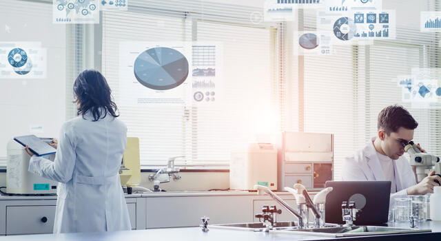 Researchers working in lab and digital data